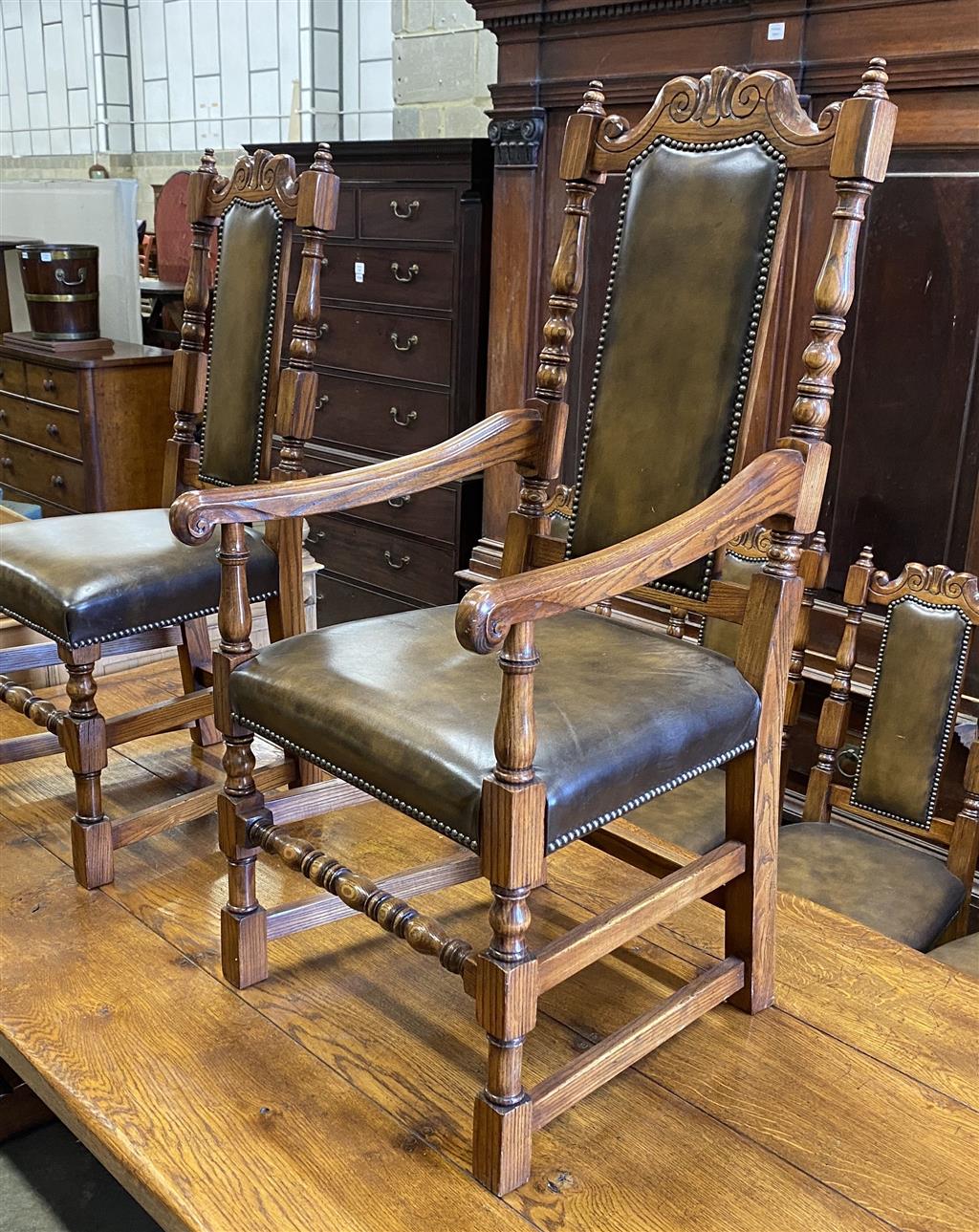 A set of ten 18th century style oak brown leather dining chairs (two with arms)